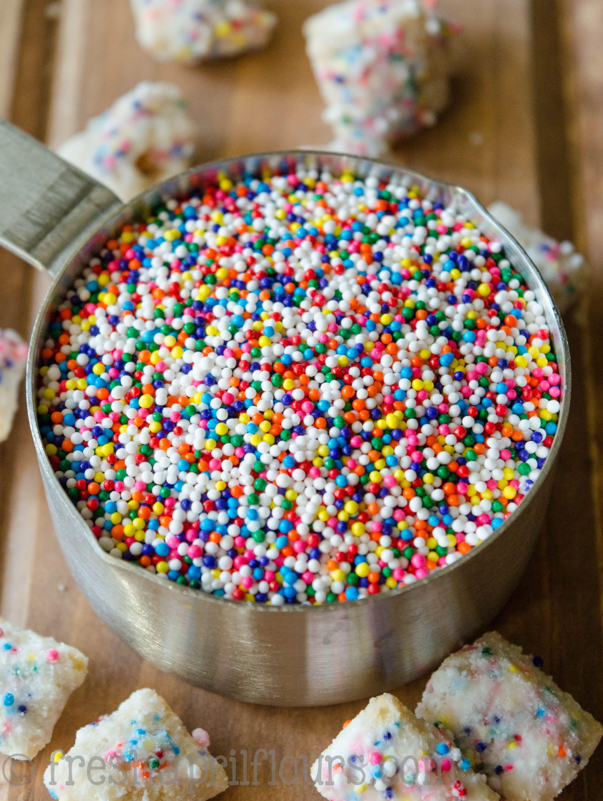 measuring cup full of nonpareils