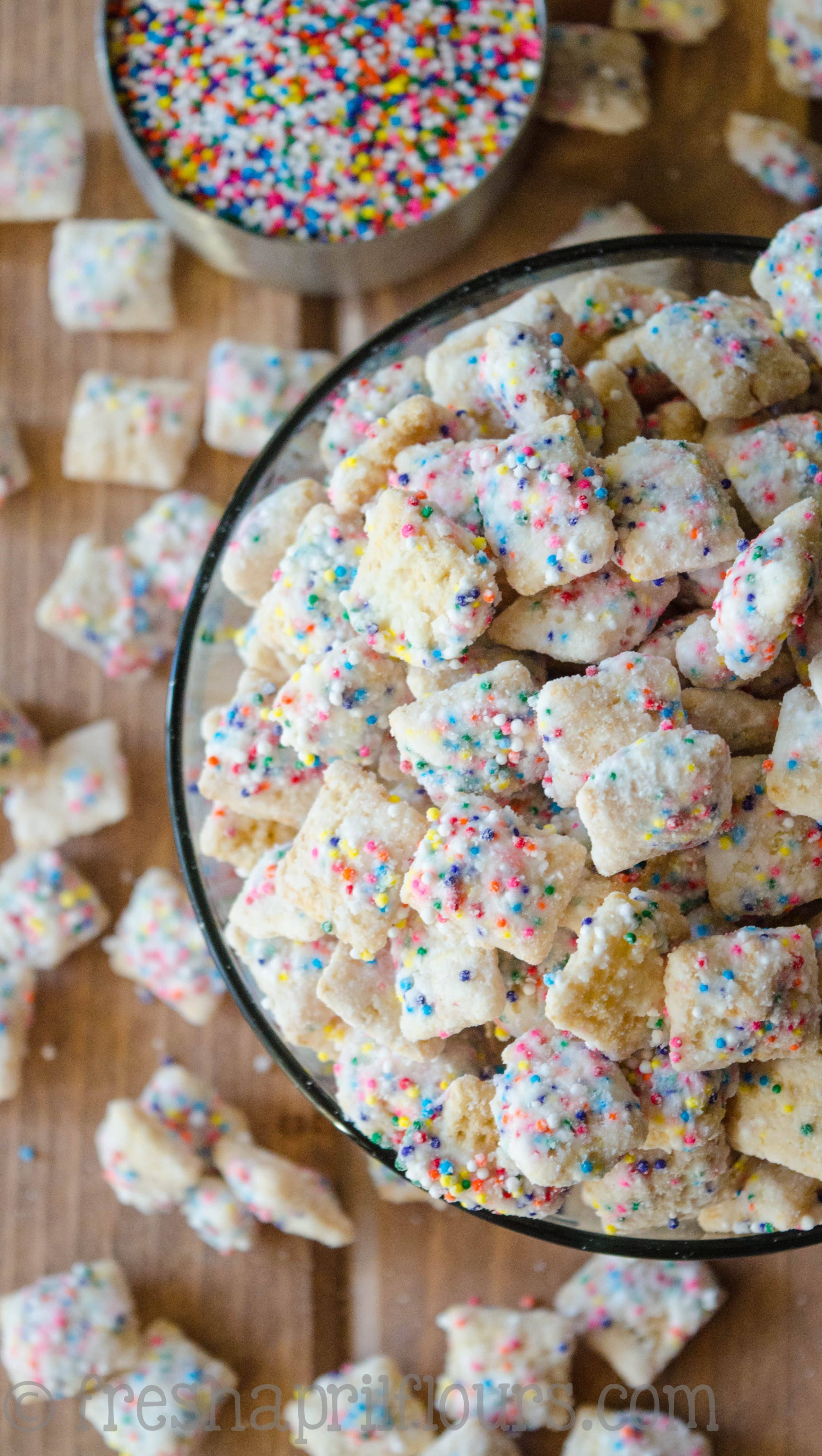 Call it funfetti puppy chow, call it birthday cake puppy chow-- this is the crunchy, cake-battery take on the classic Puppy Chow you want for your next celebration! via @frshaprilflours