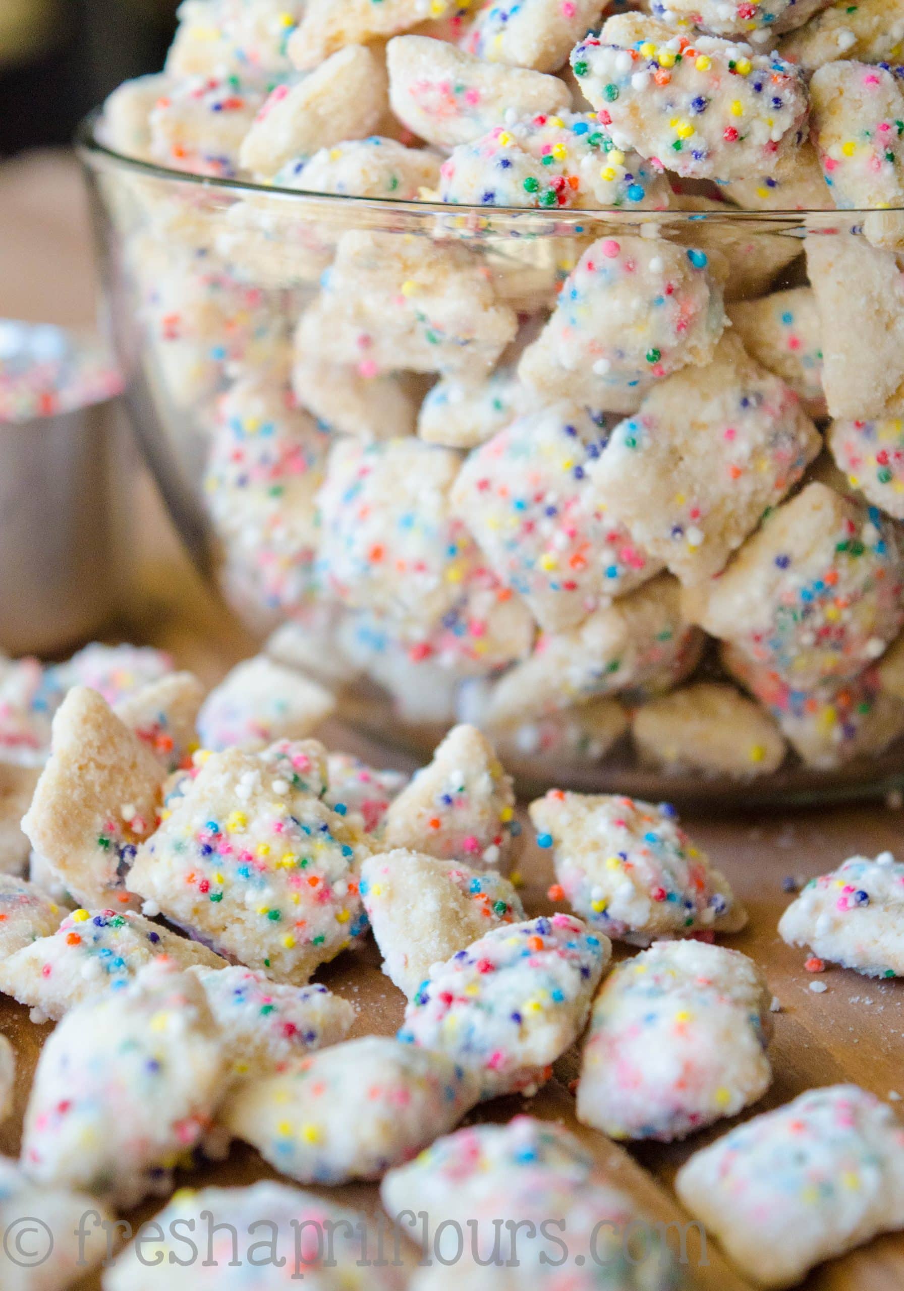 Call it funfetti puppy chow, call it birthday cake puppy chow-- this is the crunchy, cake-battery take on the classic Puppy Chow you want for your next celebration! via @frshaprilflours