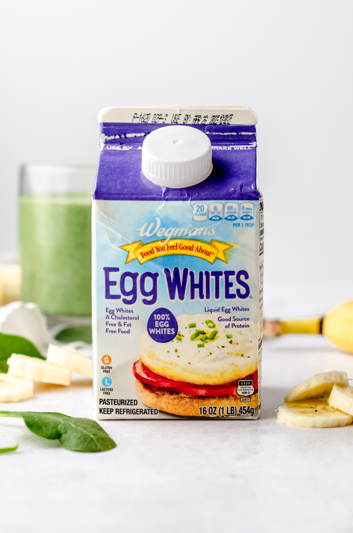 A carton of egg whites on a surface.