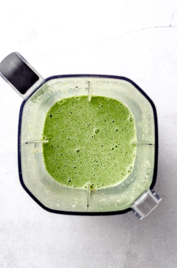 Aerial photo of a blender filled with a breakfast smoothie.