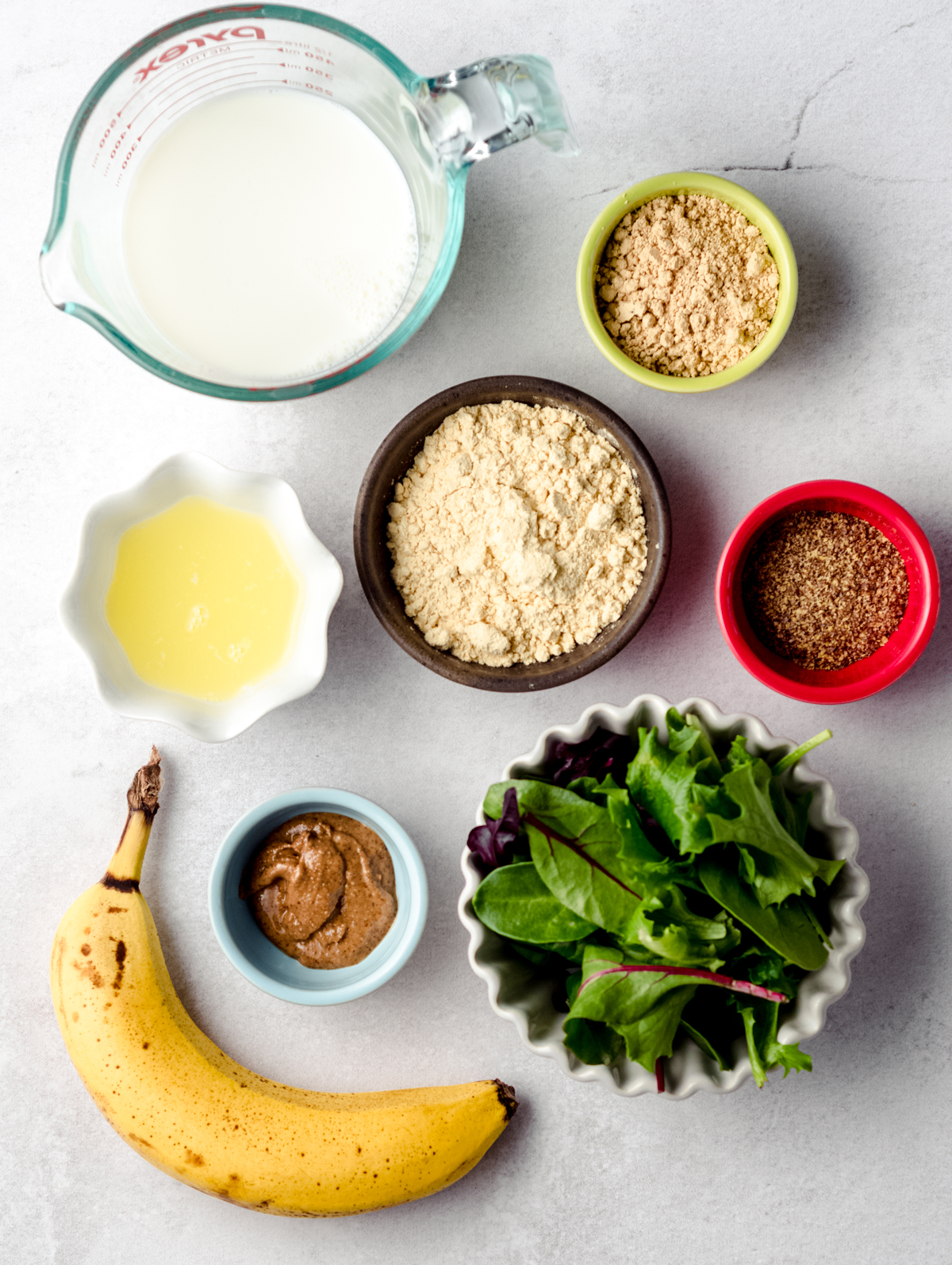 Aerial photo of ingredients to make an egg white peanut butter breakfast smoothie.