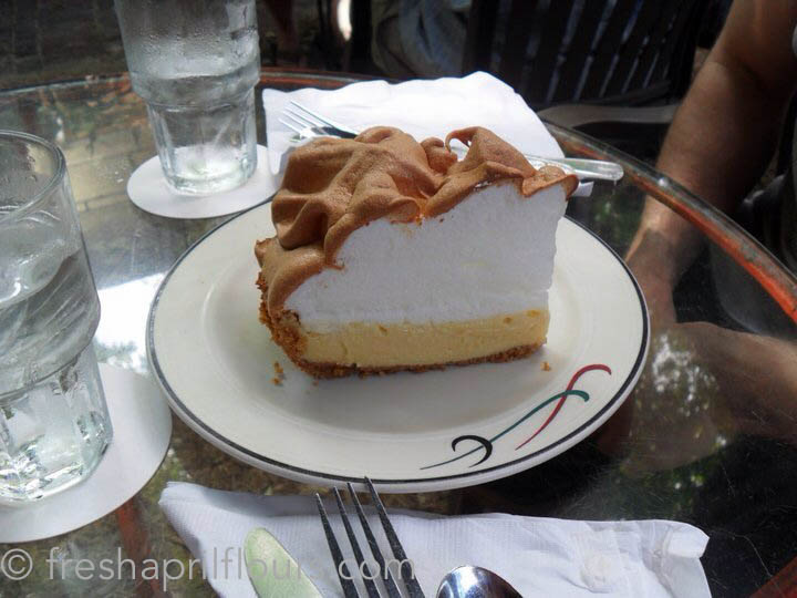 slice of authentic key lime pie on a plate in a restaurant