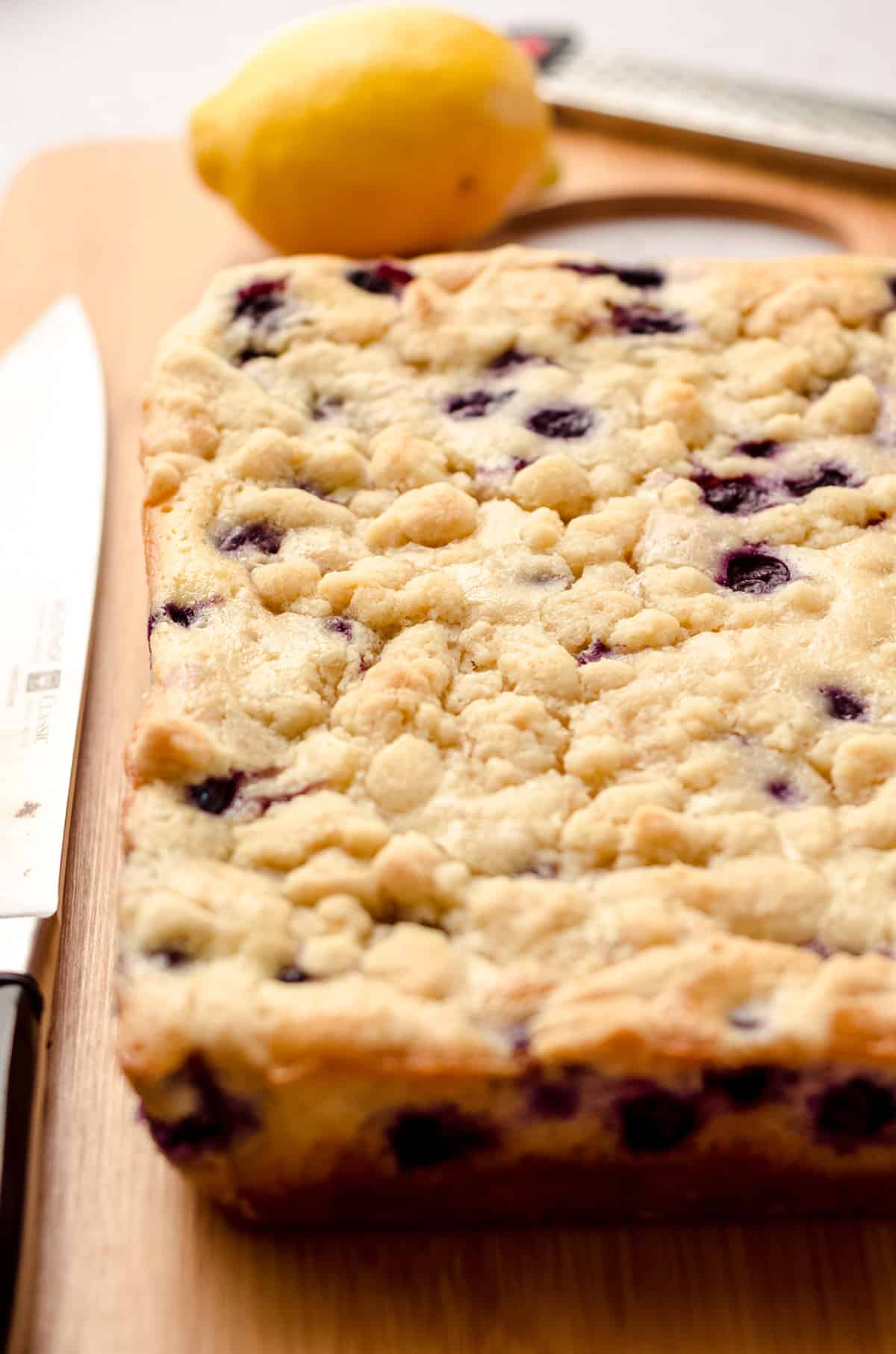 blueberry lemon bars ready to be cut