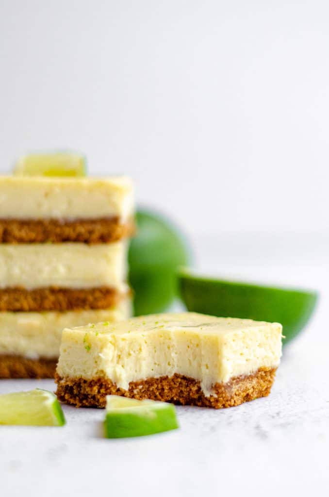 Key Lime Pie Bars: A creamy, tart Key lime pie filling sits on top of a buttery graham cracker crust... It's so much easier than making a whole pie!