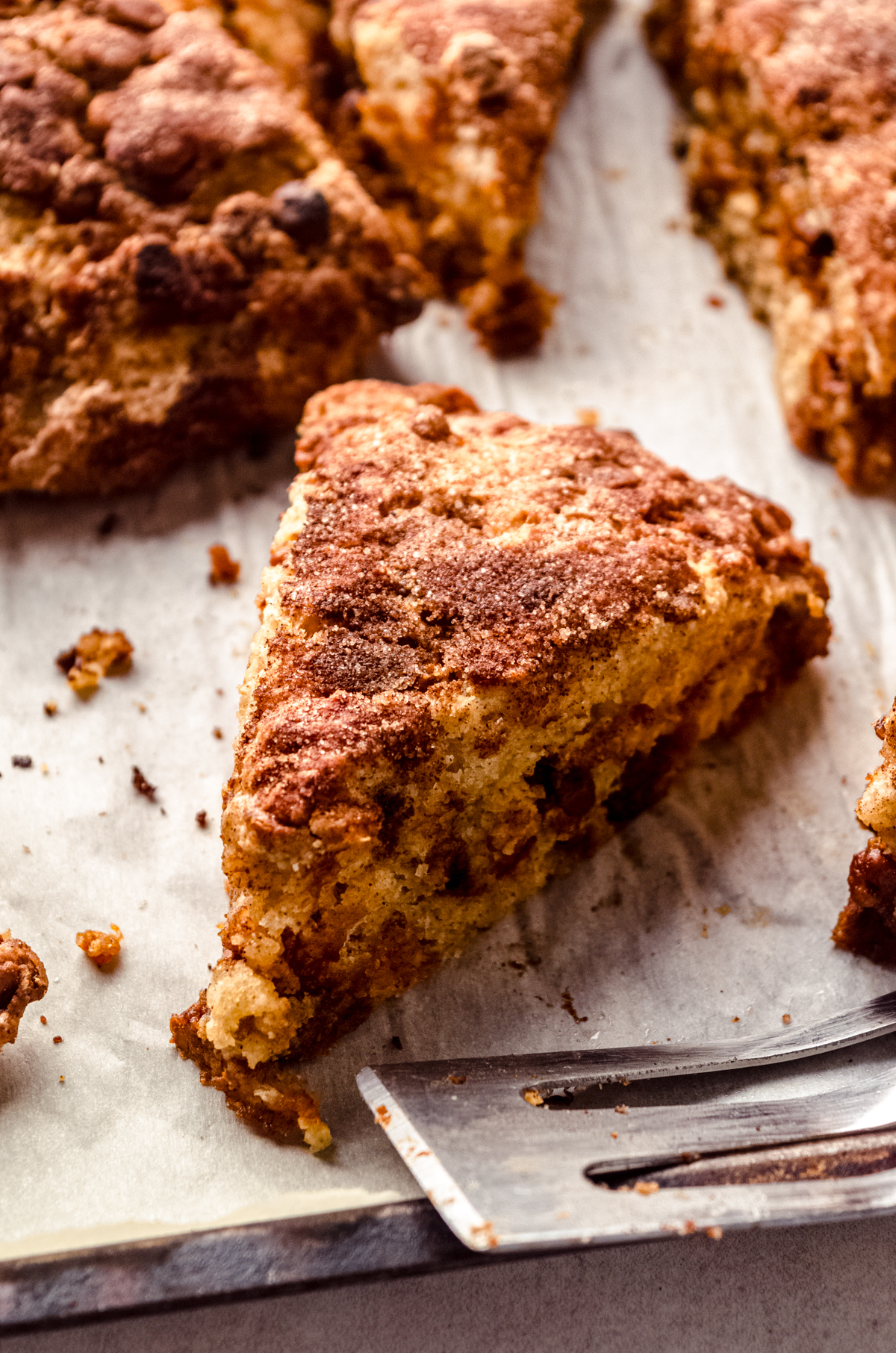 Cinnamon scones on parchment paper.