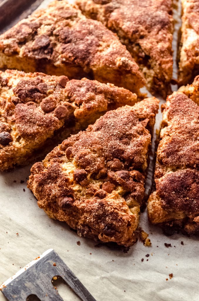 Cinnamon chip scones on parchment.