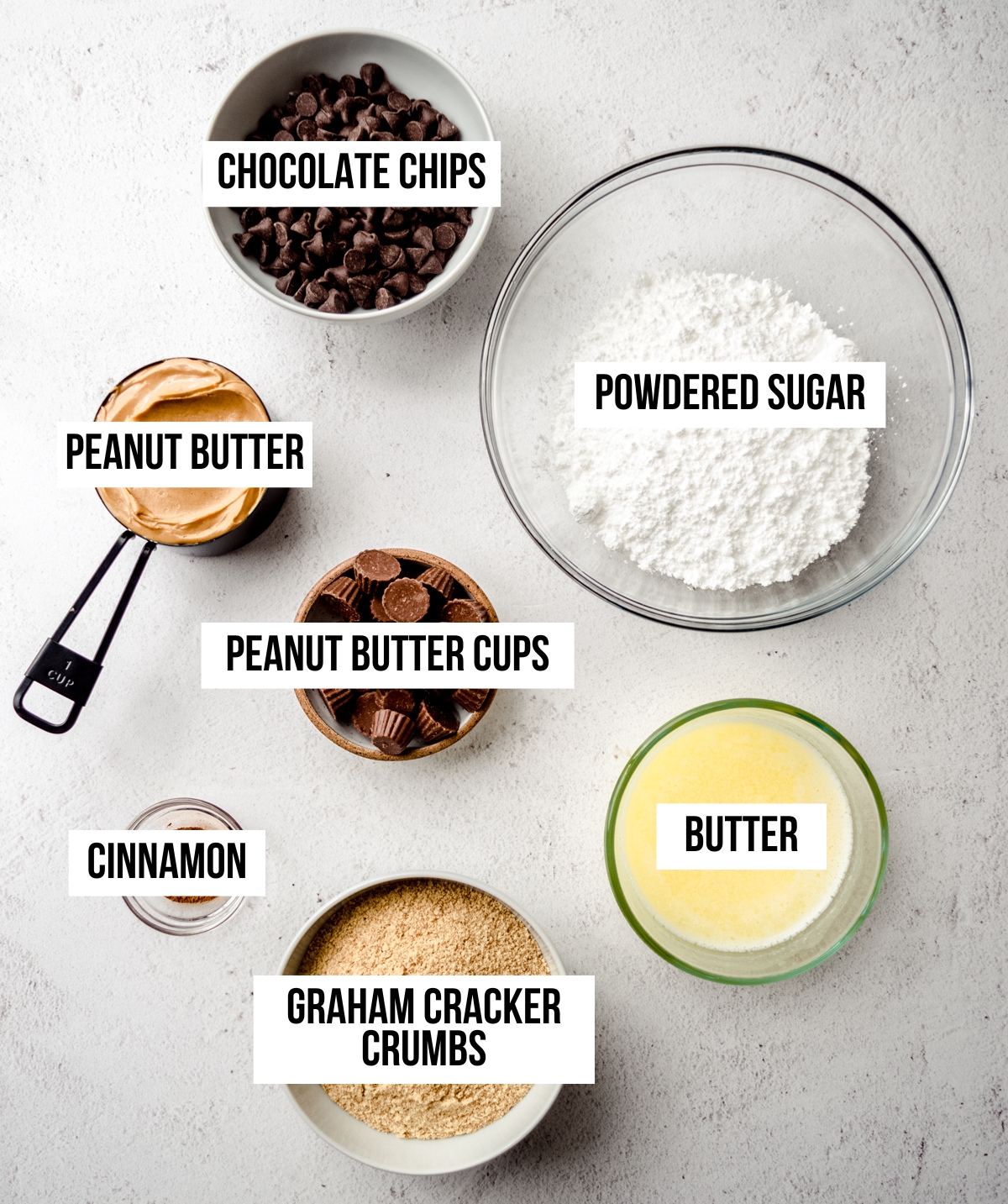 Aerial photo of ingredients to make peanut butter bars with text overlay labeling each ingredient.