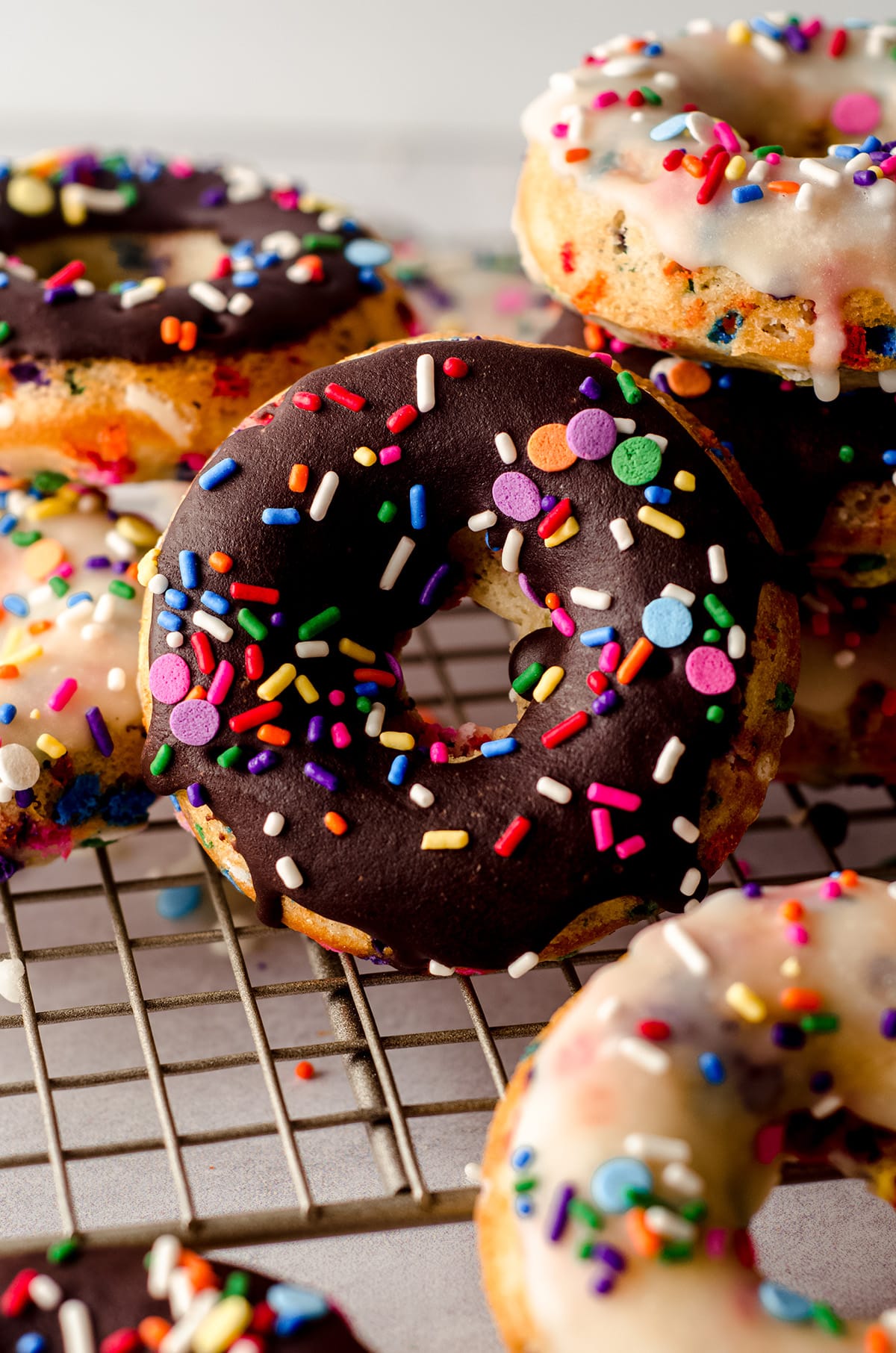 funfetti donuts on a cooling rack