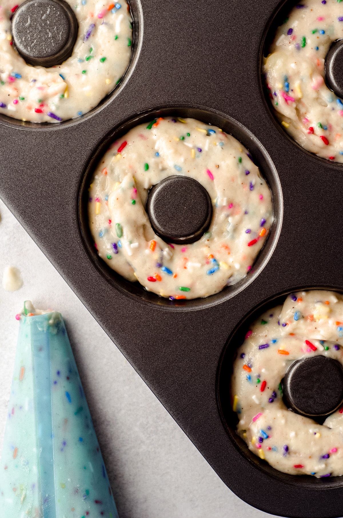 funfetti donut batter in a donut pan