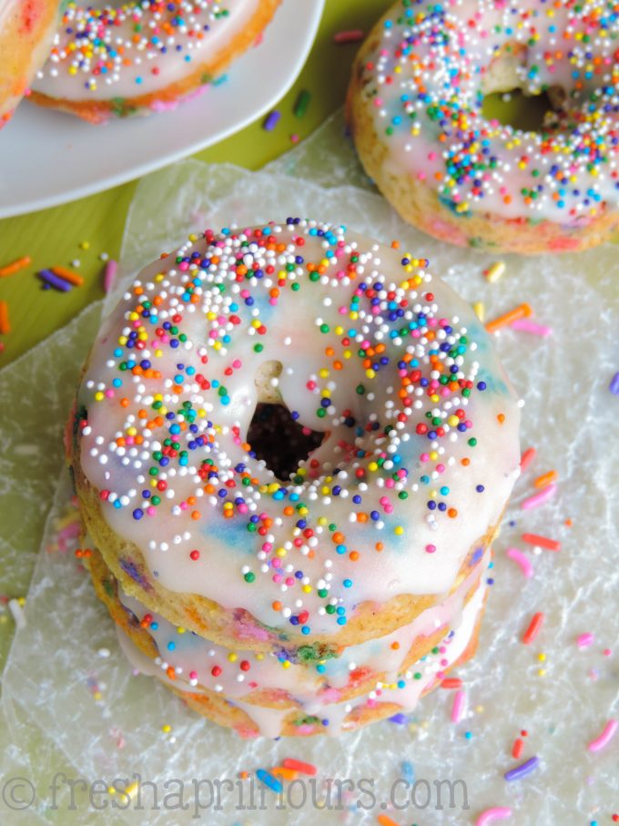 Funfetti Donuts: Glazed donuts with plenty of sprinkles inside and out! Baked, not fried, and oh-so simple.