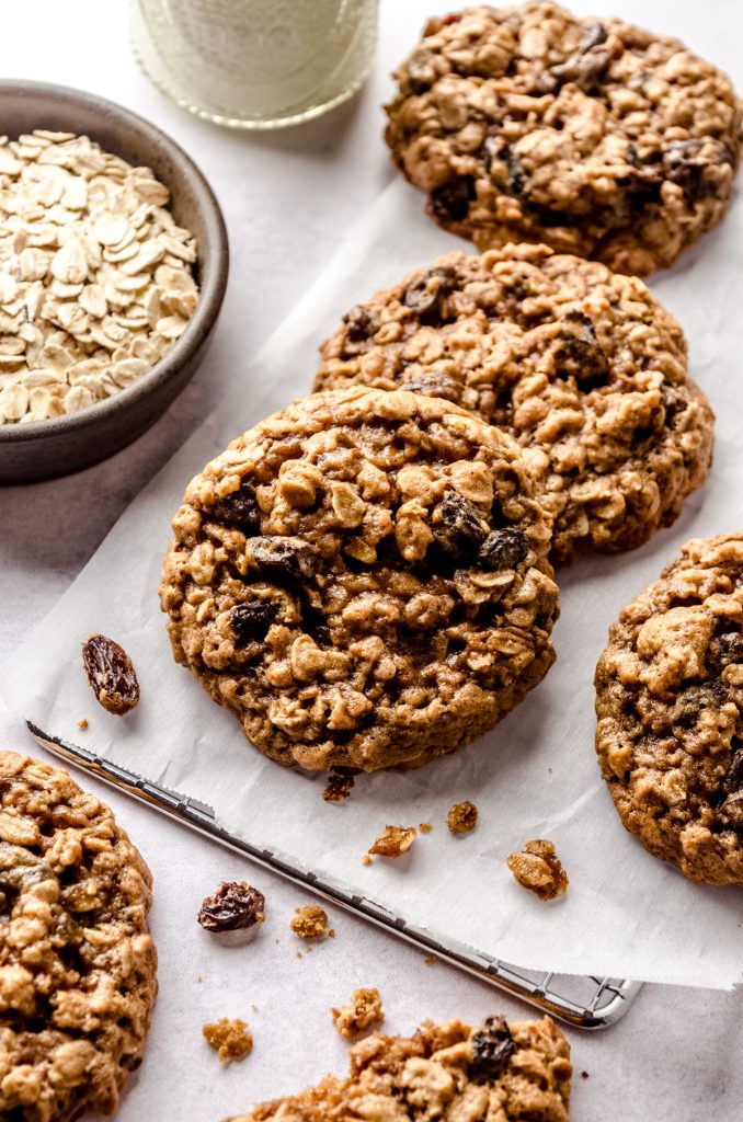Chewy oatmeal raisin cookies on a surface.