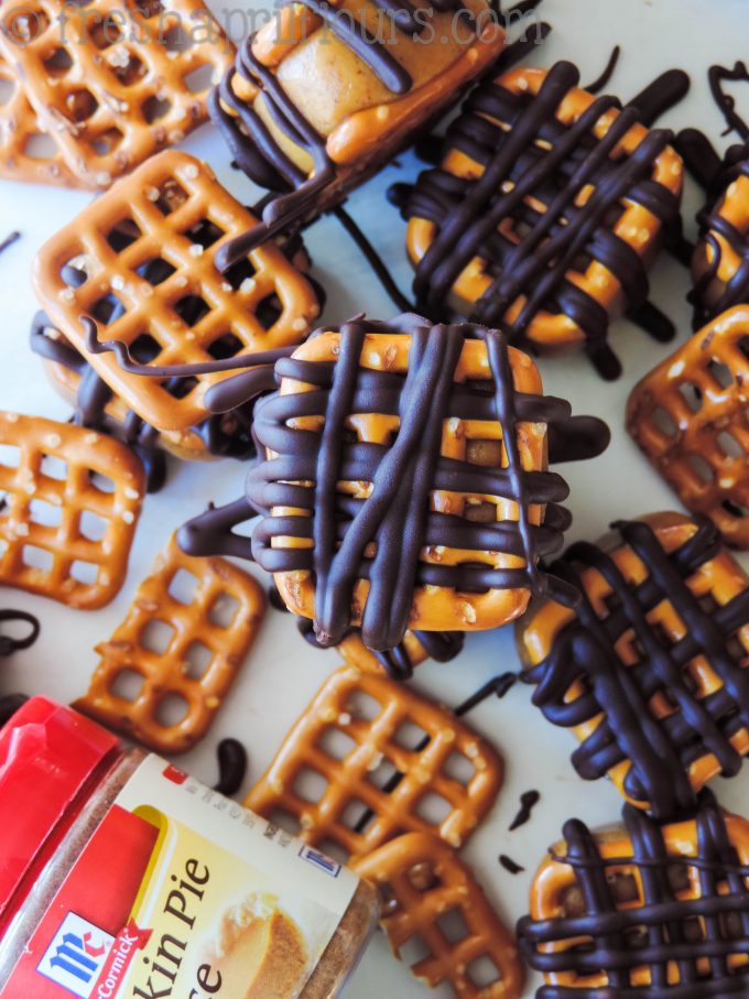 pumpkin peanut butter pretzel bites drizzled in chocolate