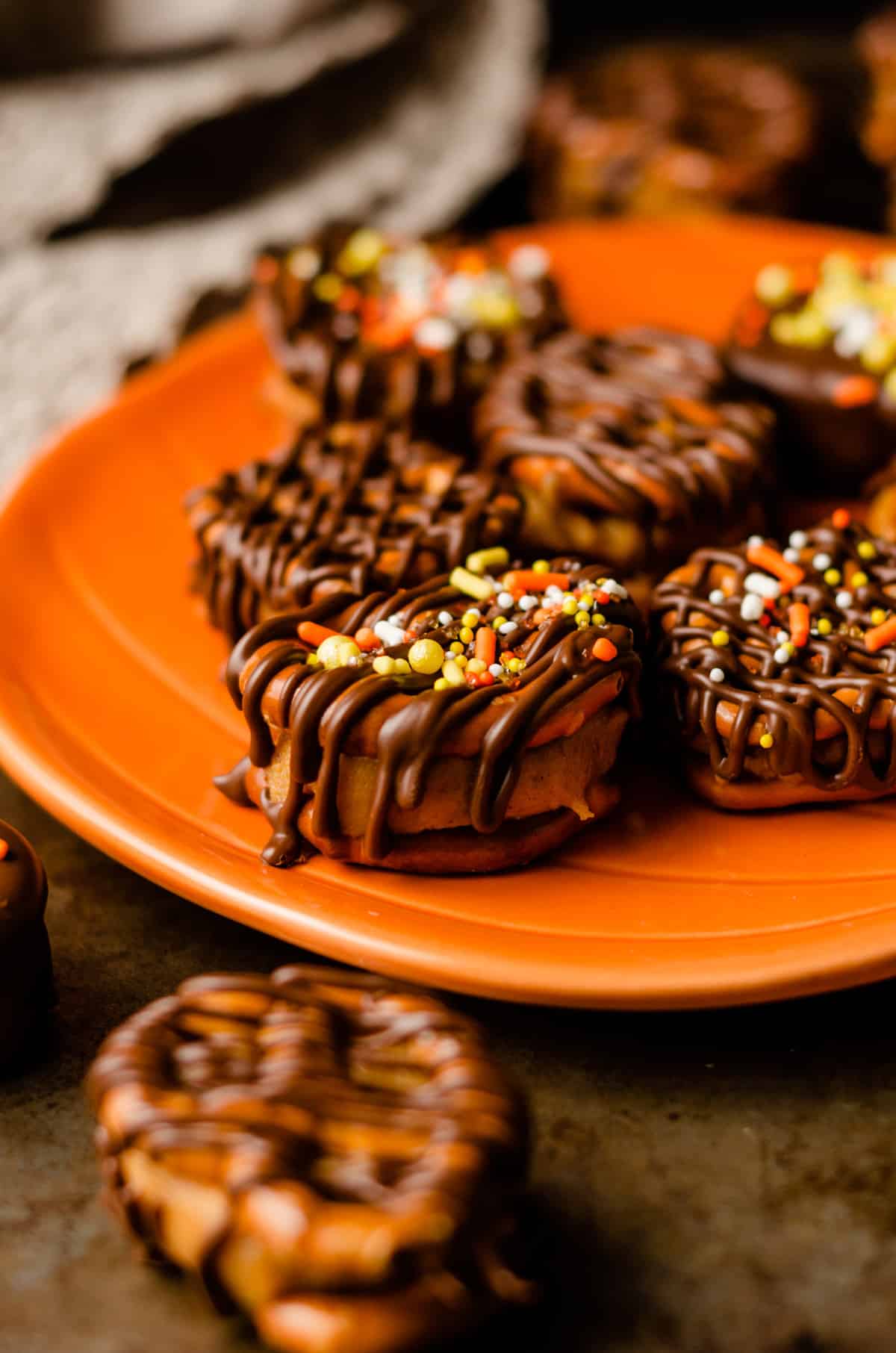 pumpkin peanut butter pretzel bites on a plate