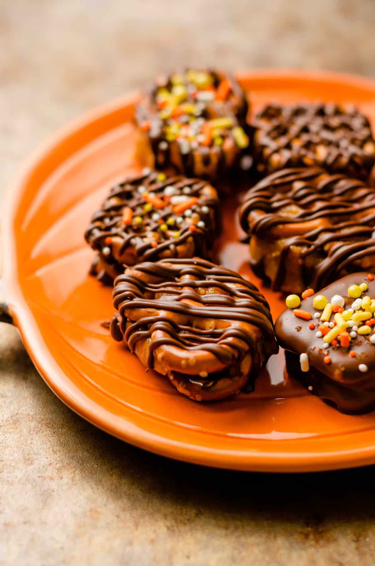 pumpkin peanut butter pretzel bites on a plate