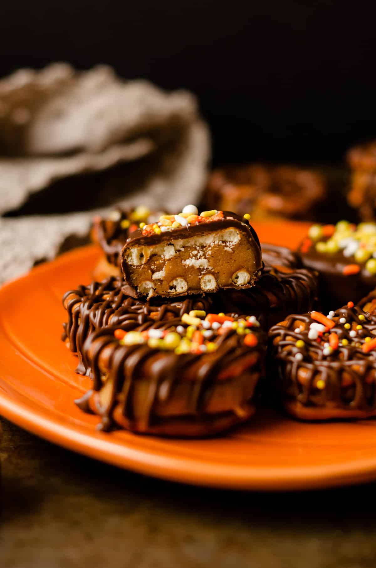 pumpkin peanut butter pretzel bites on a plate