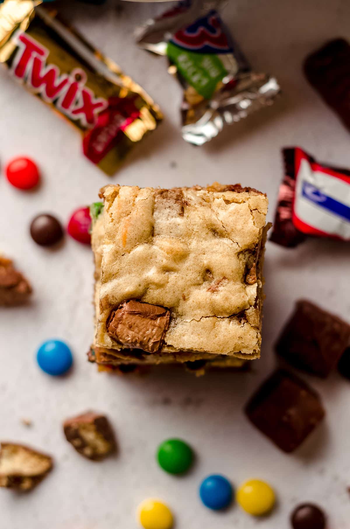 aerial photo of candy bat blondies with candies scattered around