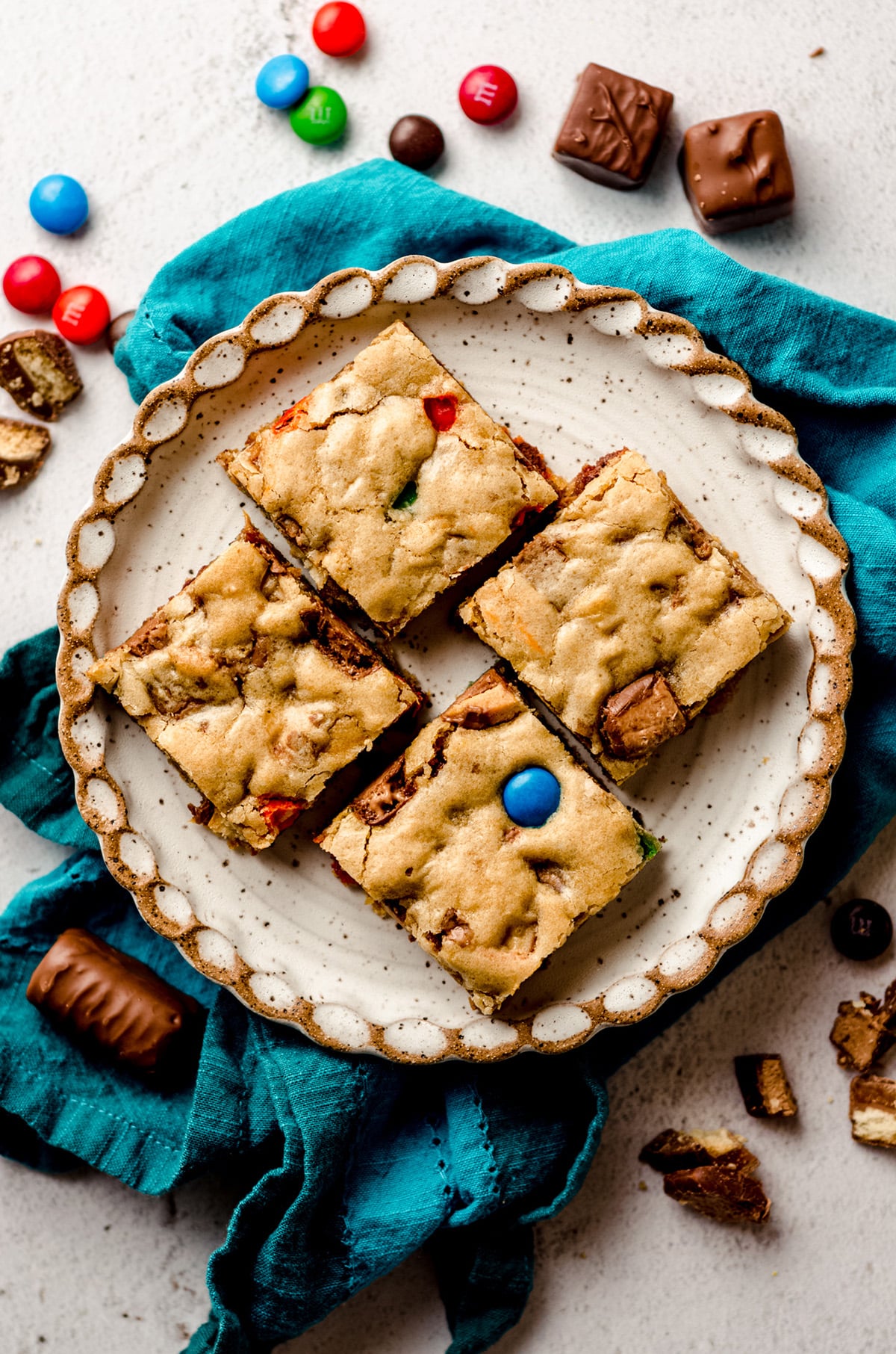 aerial photo of candy bar blondies on a plate