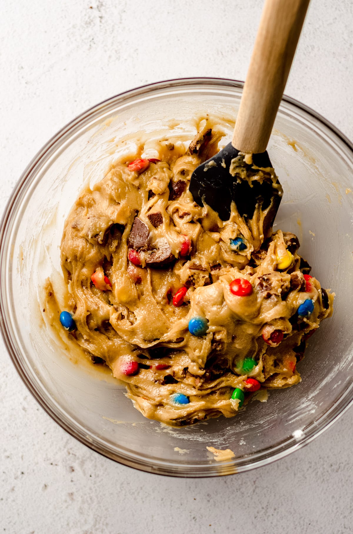 candy bar blondie batter in a glass bowl