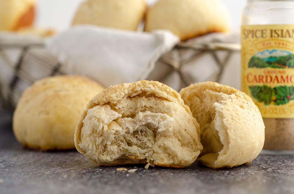 cardamom roll broken apart to see the inside of the roll