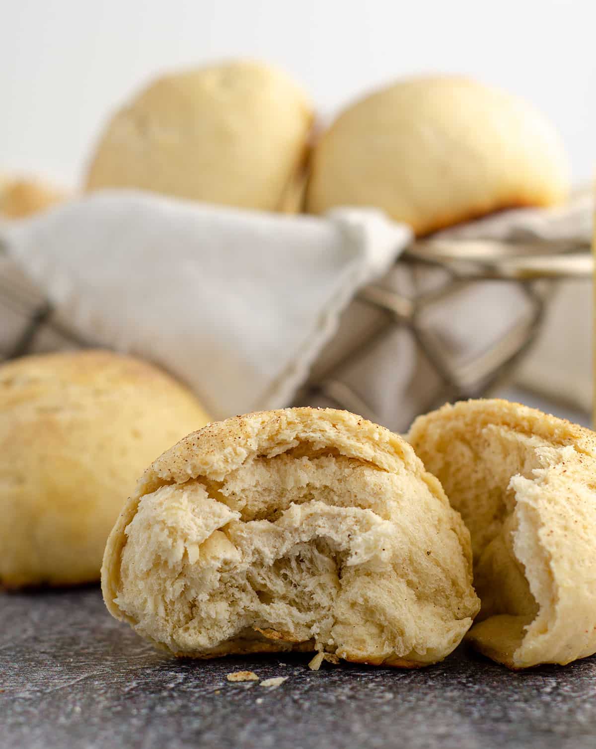 cardamom roll broken apart to see the inside of the roll