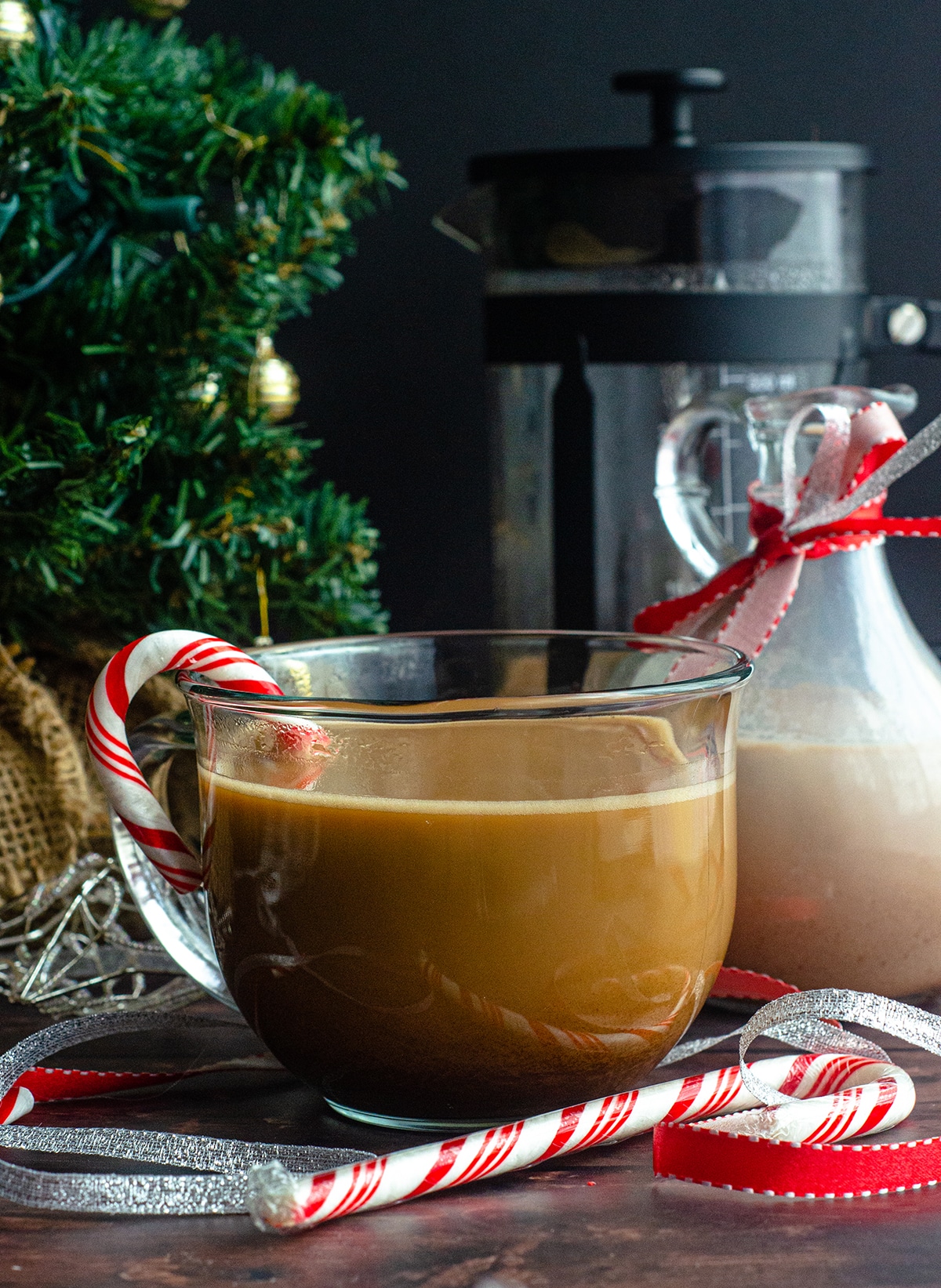 cup of coffee with candy cane in it