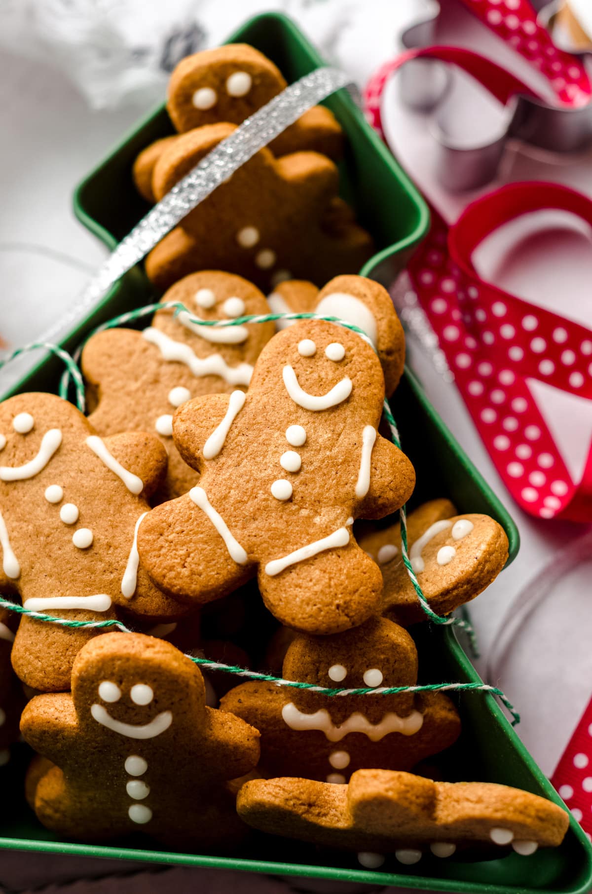 aerial photo of gingerbread cut-out cookies in a christmas tree tin