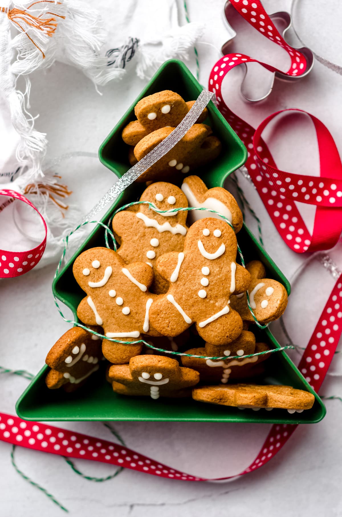 aerial photo of gingerbread cut-out cookies in a christmas tree tin