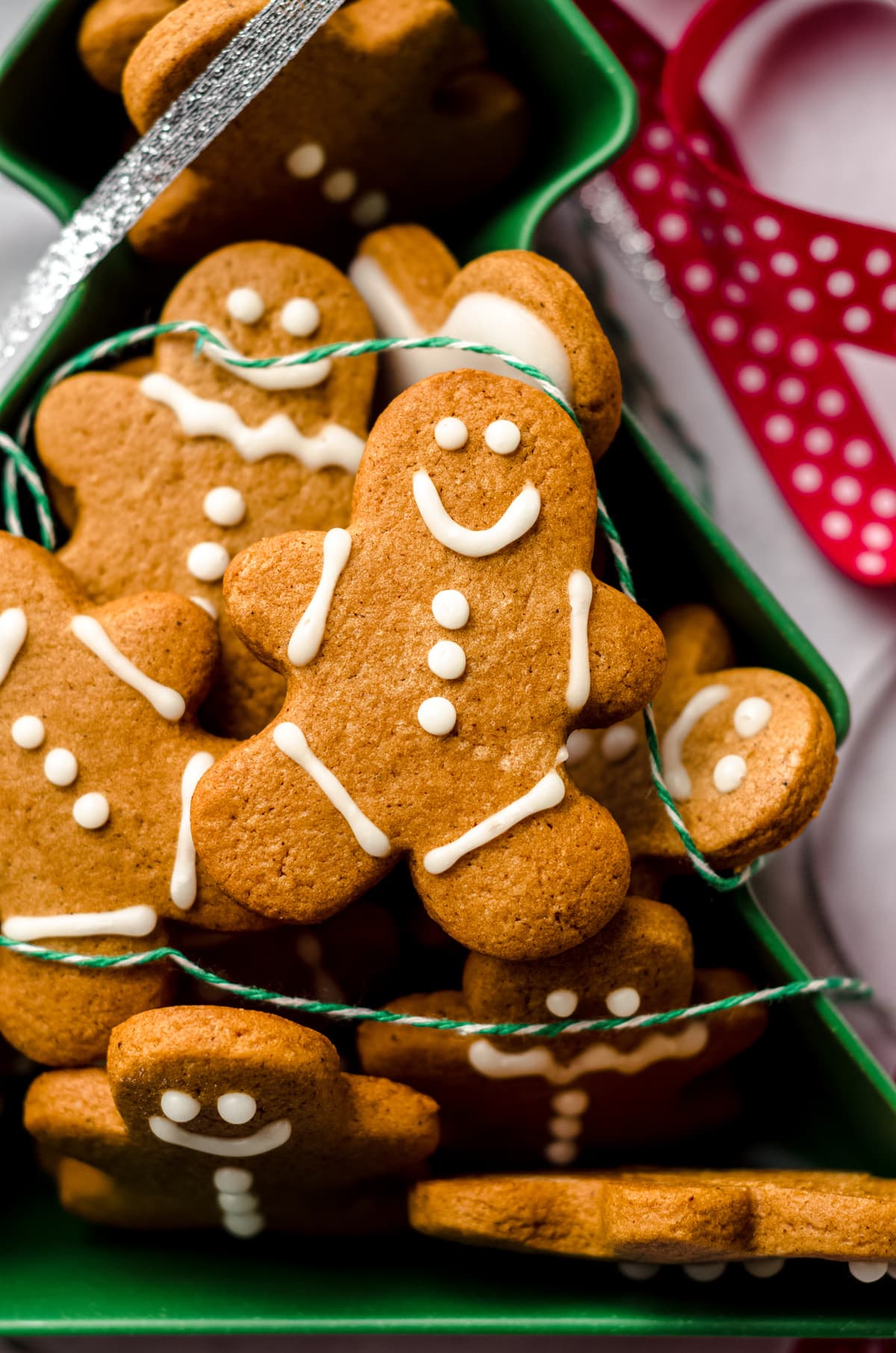 aerial photo of gingerbread cut-out cookies in a christmas tree tin