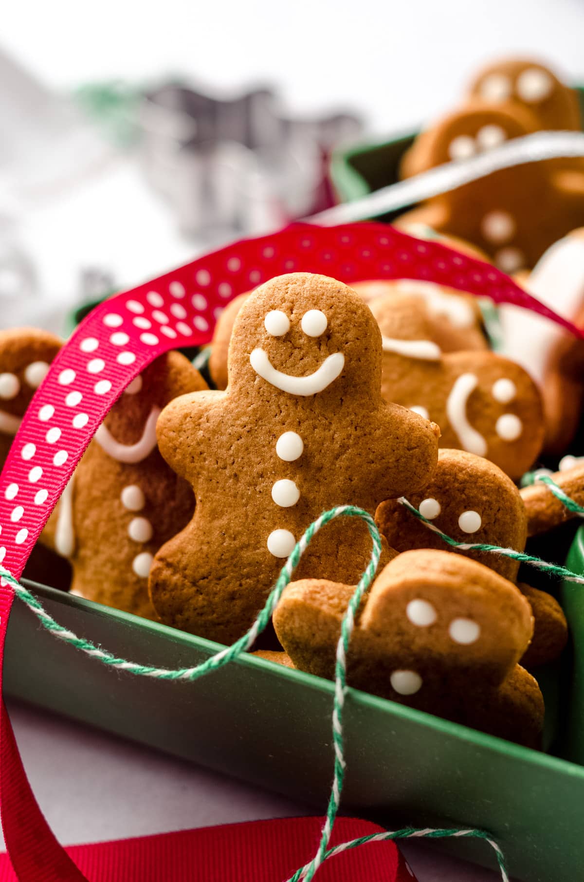 gingerbread cut-out cookies in a christmas tree tin