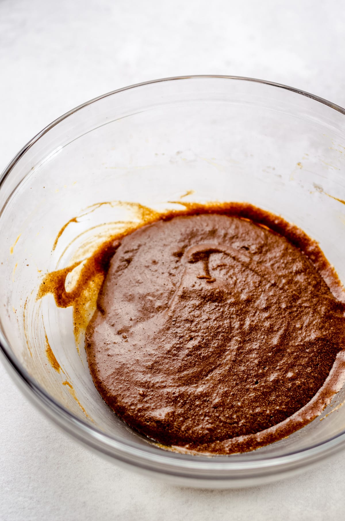 wet ingredients for cut-out gingerbread cookies in a glass bowl