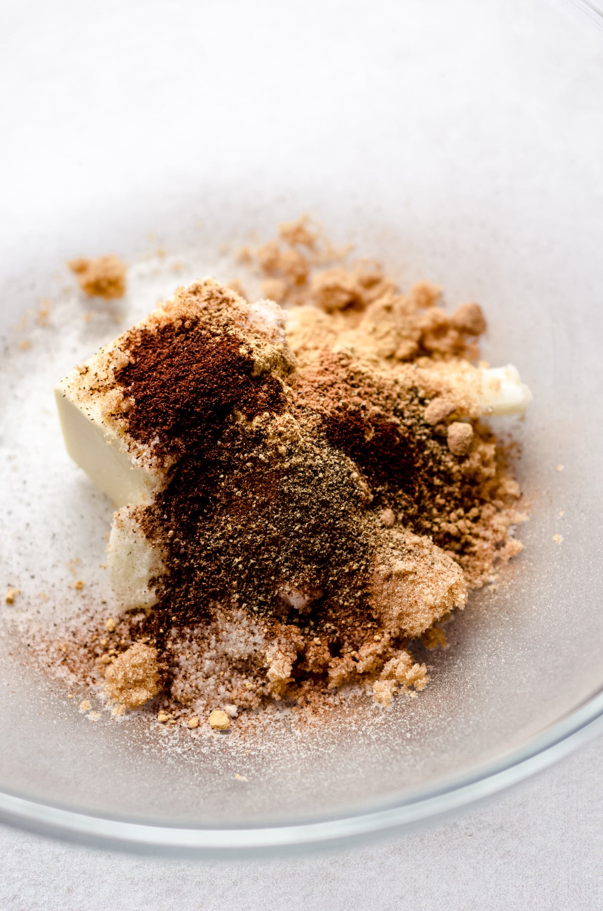 ingredients for gingerbread cut-out cookie dough in a glass bowl