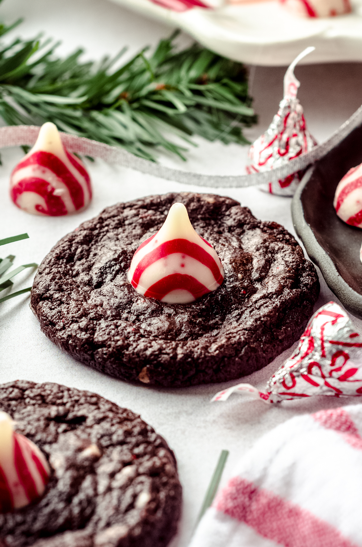 Chocolate peppermint blossom cookies on a surface.