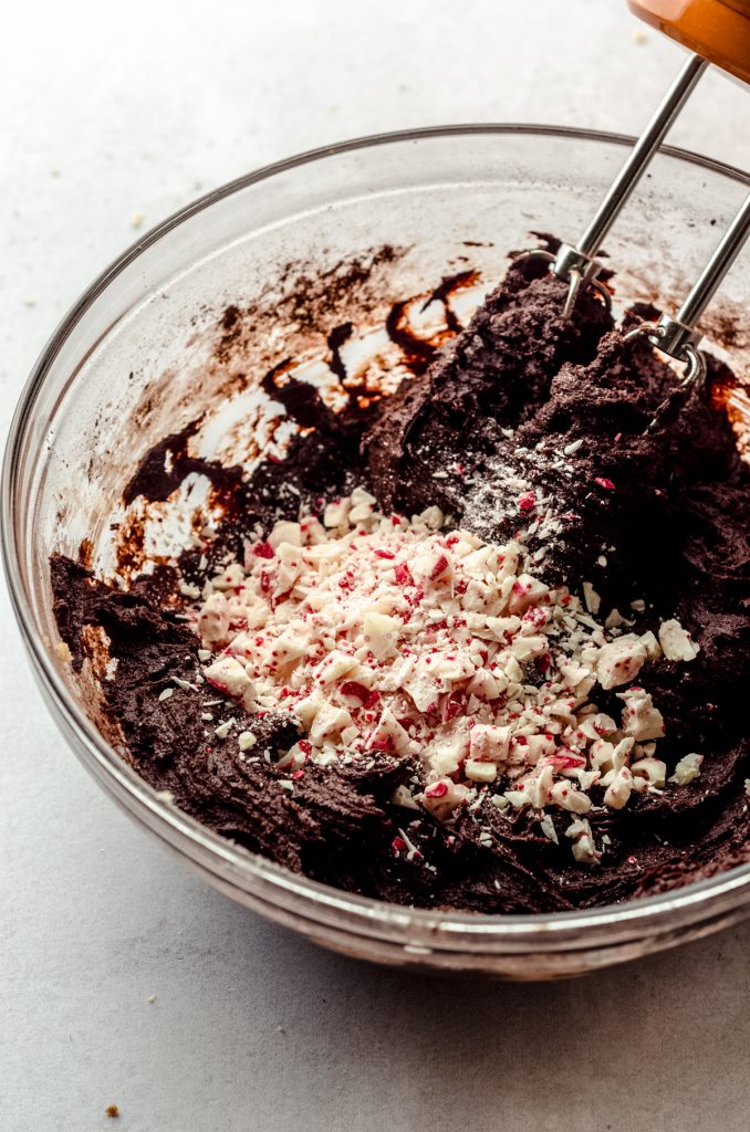 Chocolate peppermint blossom cookie dough in a bowl.