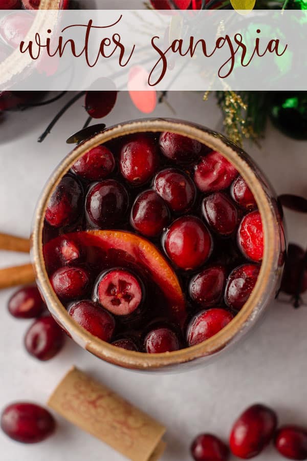 This spiced winter sangria is made with a mulled cranberry syrup, cinnamon and cloves, freshly squeezed orange juice, triple sec, and red wine. via @frshaprilflours
