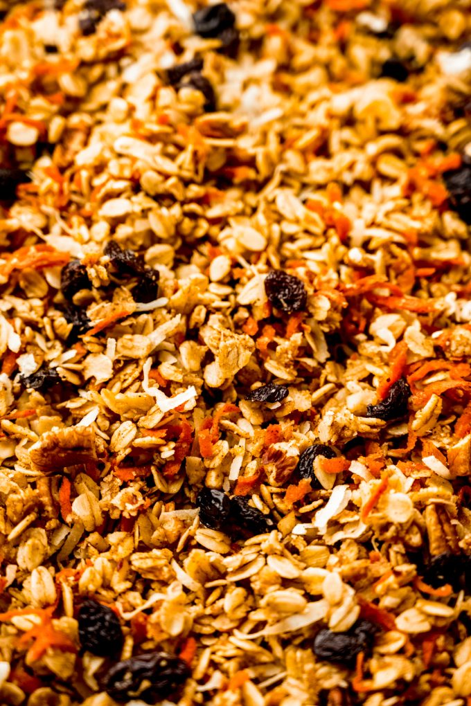 Aerial photo of soft baked carrot cake granola on a baking sheet.