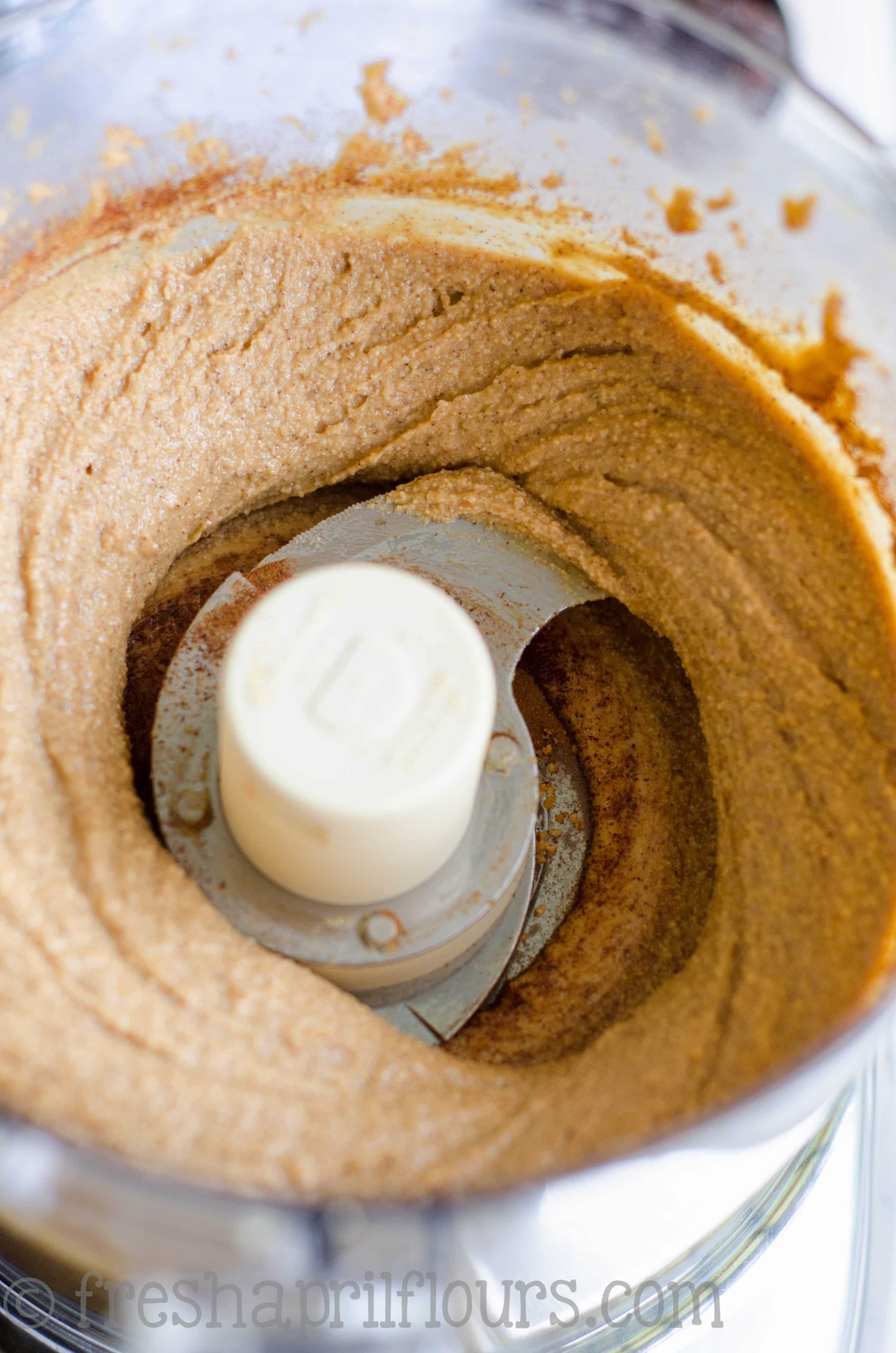 cinnamon raisin peanut butter in the bowl of a food processor