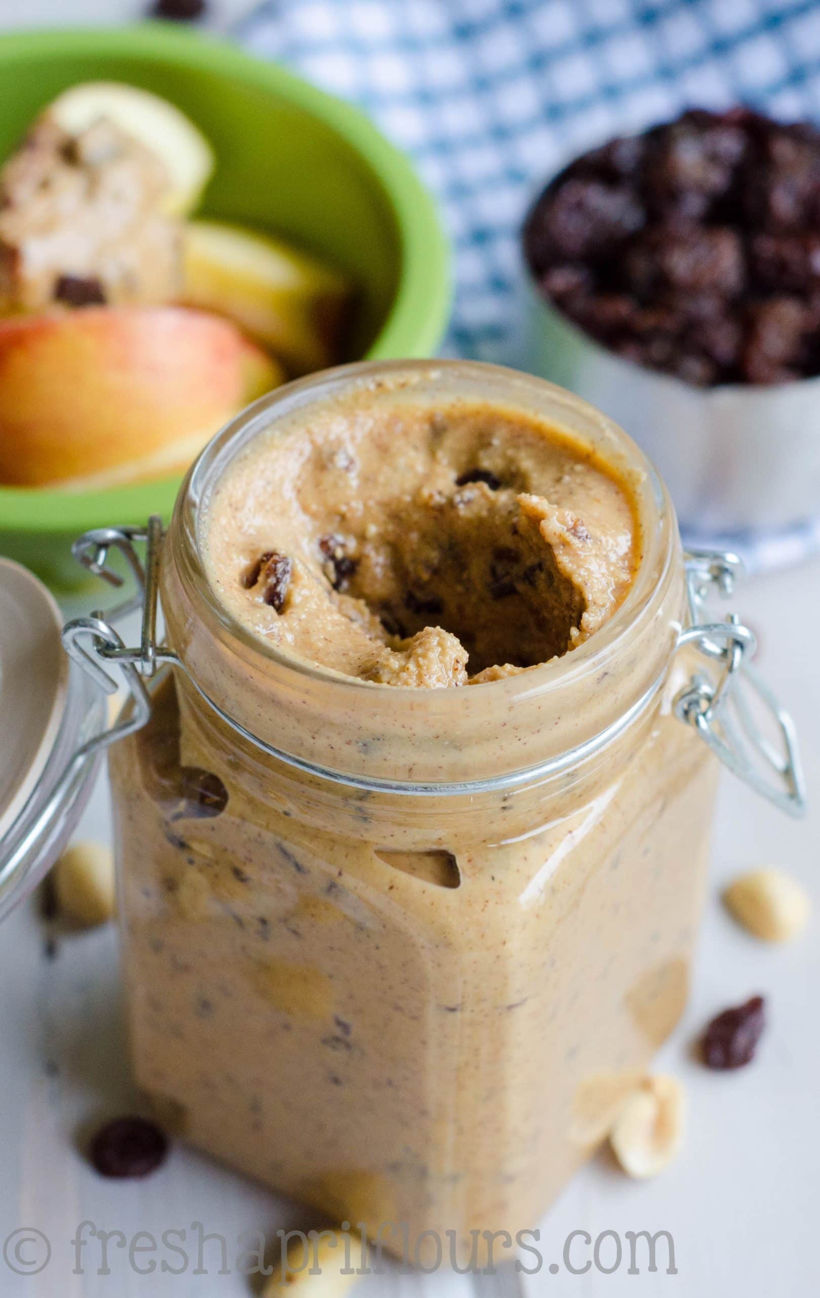 Mouthwatering homemade peanut butter that is lightly spiced with cinnamon and sweetened up with raisins. via @frshaprilflours