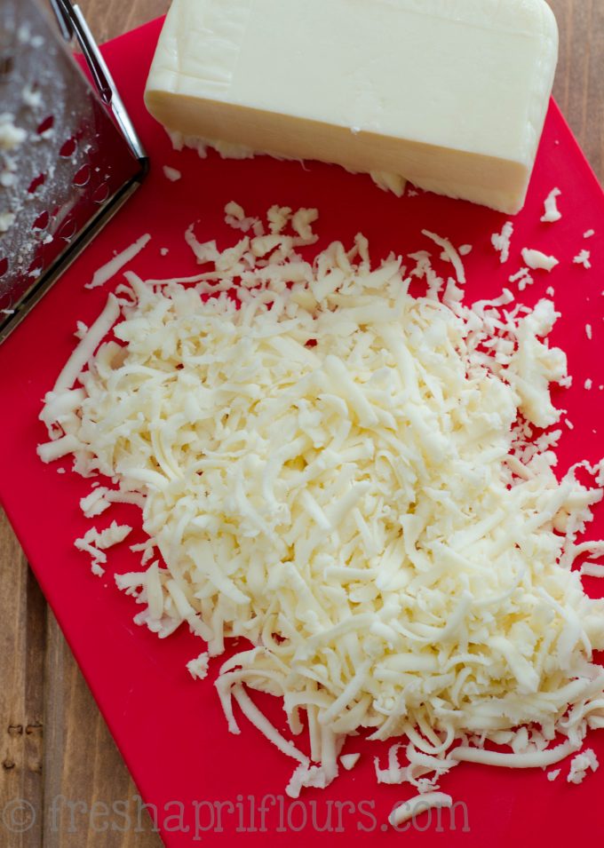 aerial photo of pile of freshly shredded mozzarella cheese