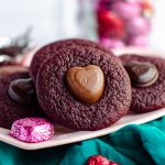 Red Velvet Blossom Cookies: Soft and chewy red velvet cookies, topped with a chocolate heart. No box mix required-- they're made completely from scratch!