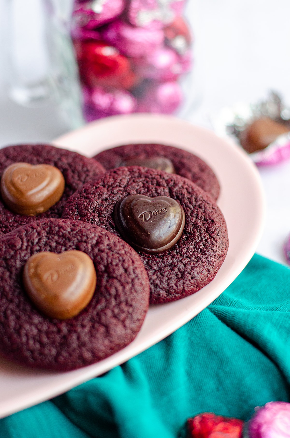 red velvet blossom cookies on a pink plate