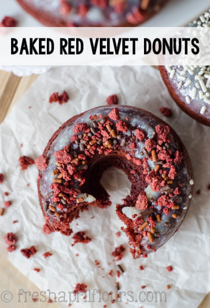 Fluffy, lightly sweetened and delicately tangy baked red velvet donuts topped with cream cheese glaze. via @frshaprilflours
