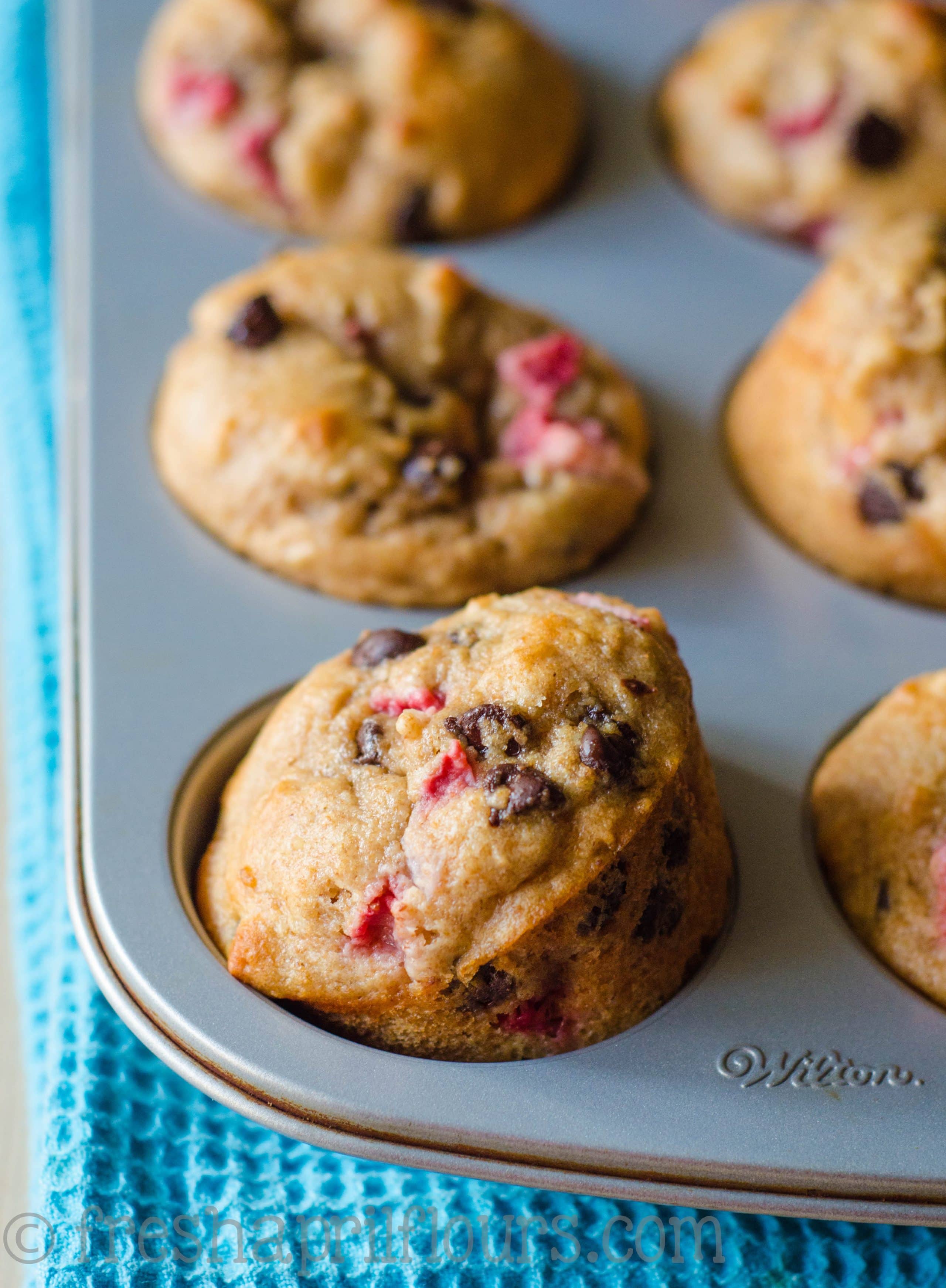 strawberry chocolate chip muffins in a pan