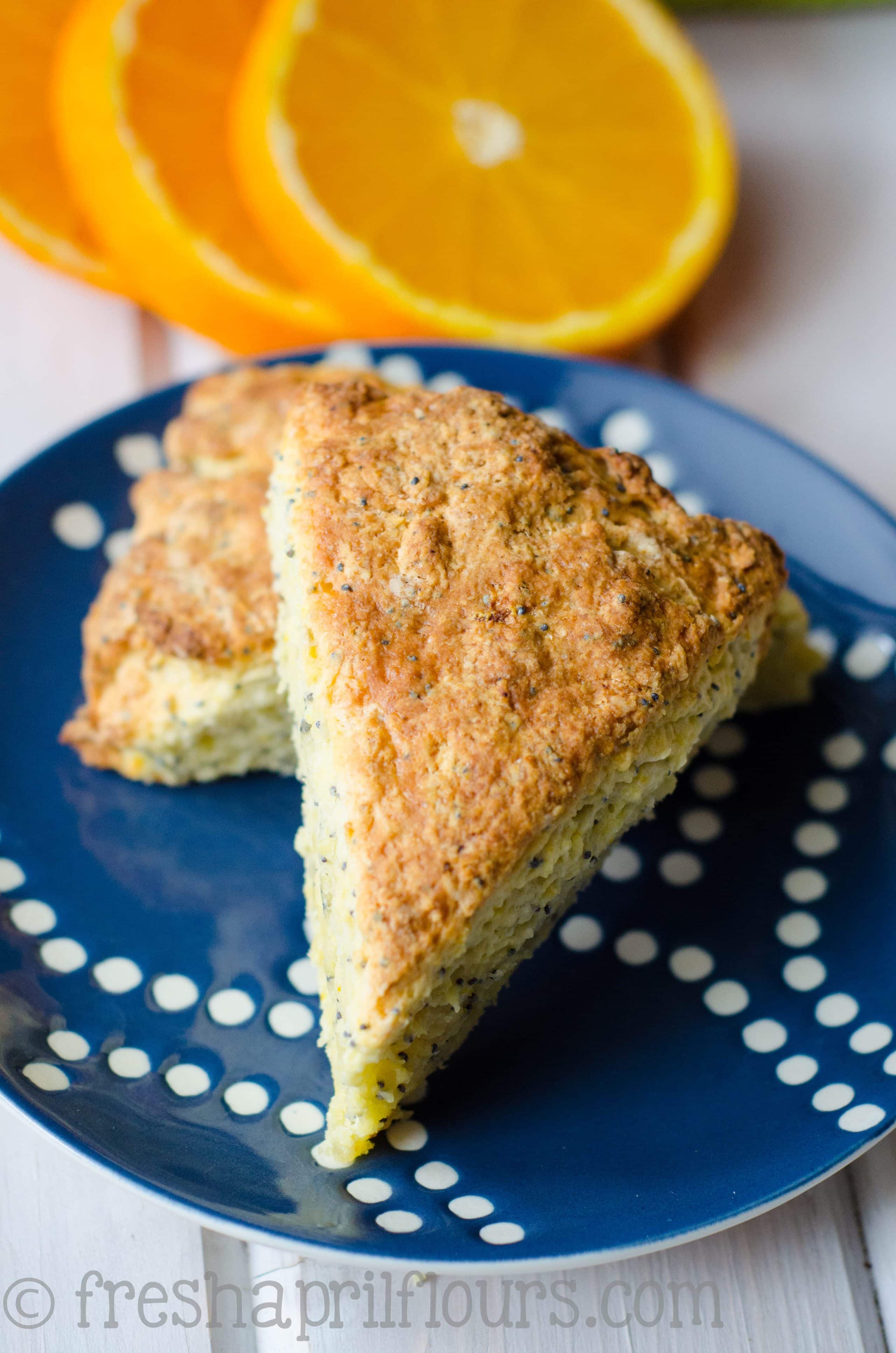 orange poppy seed scones on a plate