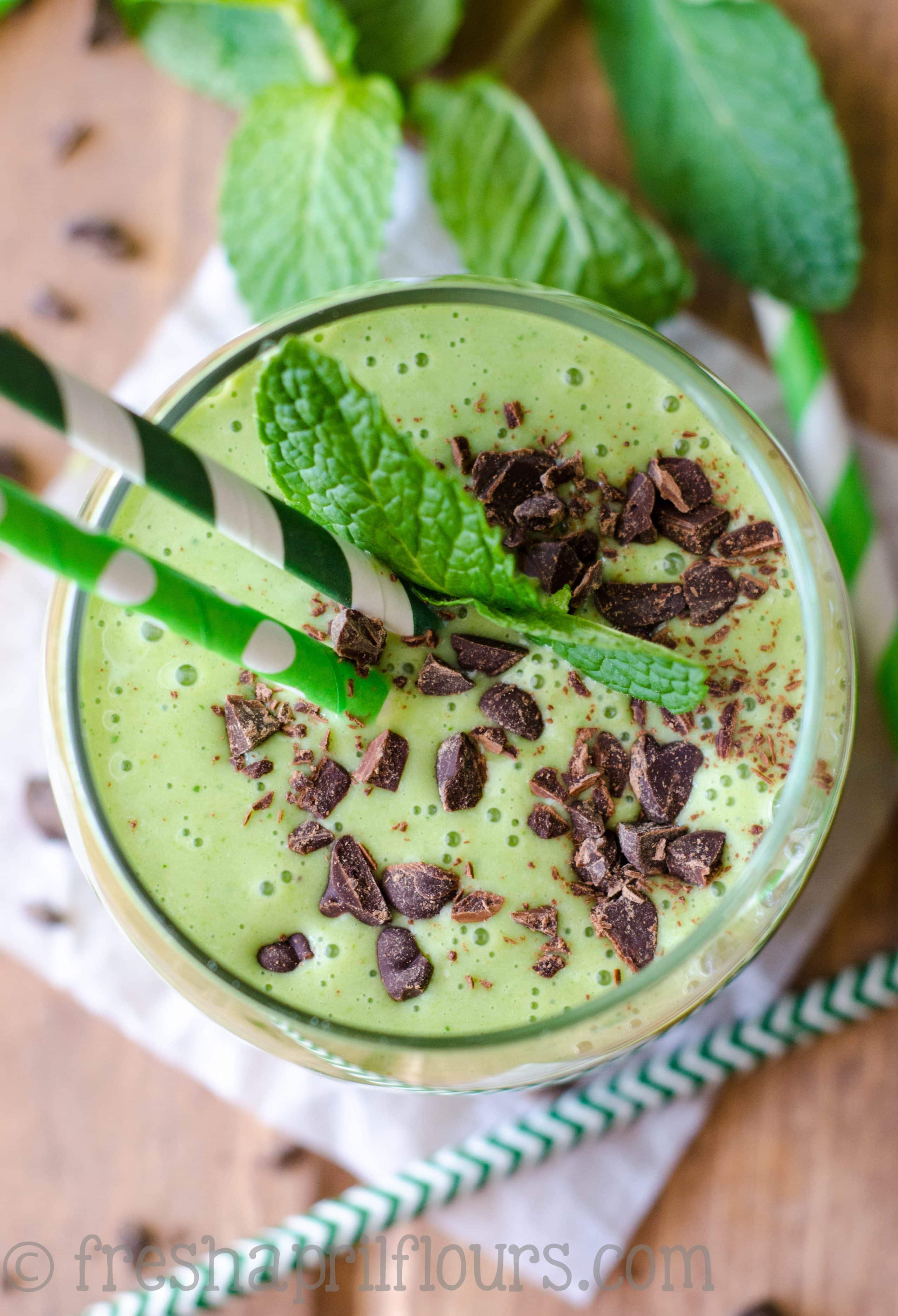 aerial photo of skinny shamrock shake in a glass with straws