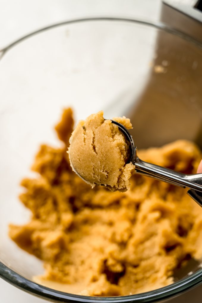 Cake pop mixture in a cookie scoop.