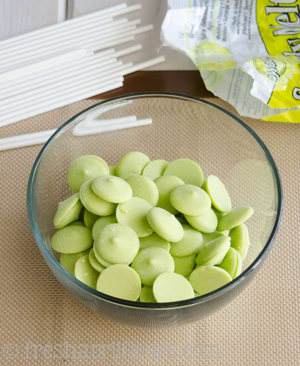 bowl of bright green candy melts