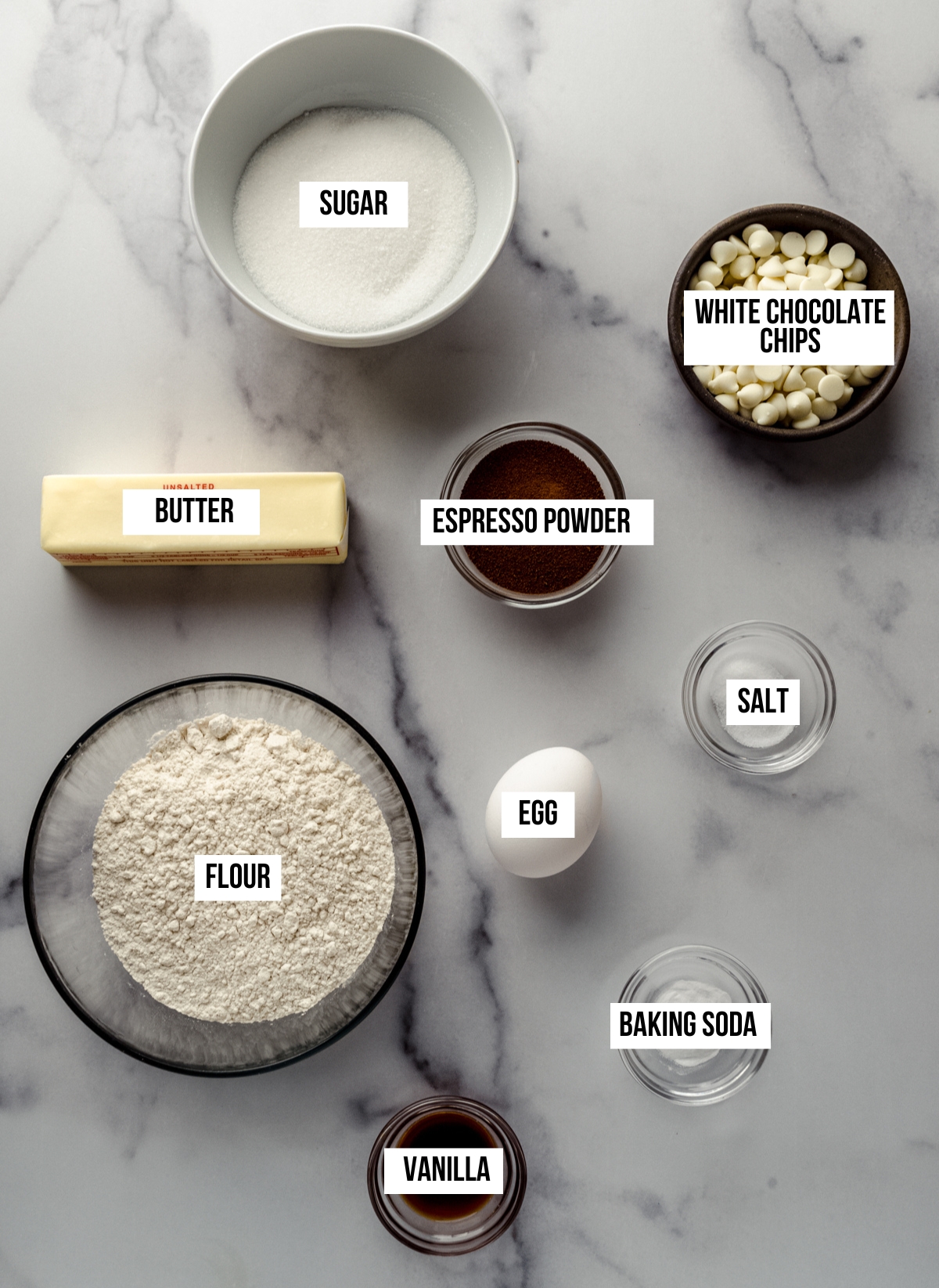 Aerial photo of ingredients to make cappuccino coffee cookies with text overlay labeling each ingredient.