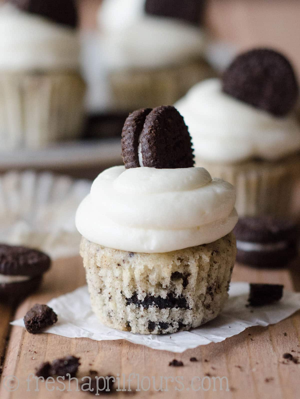 Mini cookies and cream cupcake with the wrapper off.
