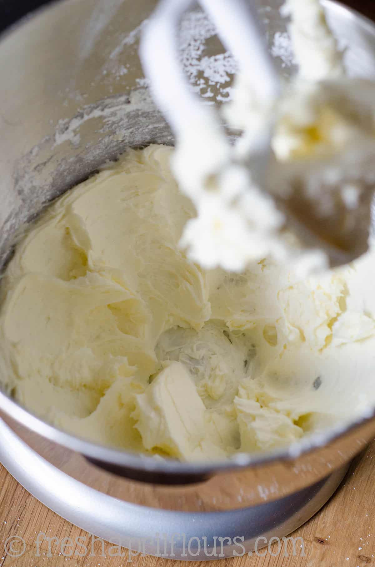 creamed butter and powdered sugar in a mixing bowl